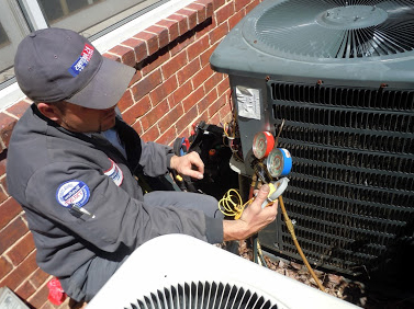 Quentin is checking the compresor pressure on an AC unit